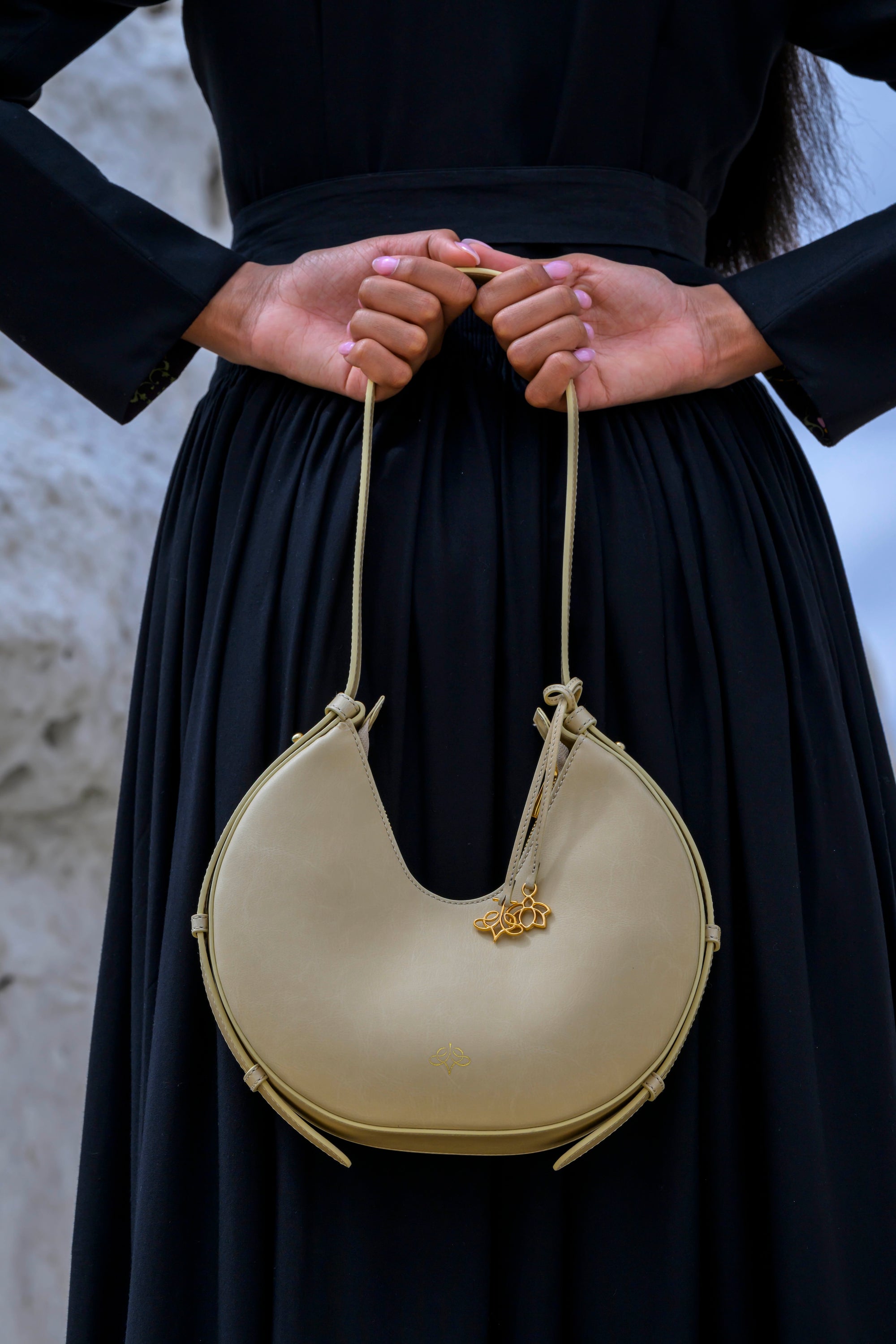 Model holding Lole Sand bag on her back