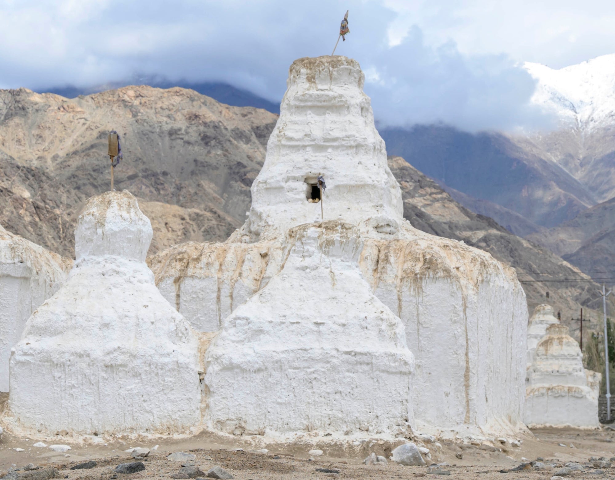 White stone structures with a mountainous background